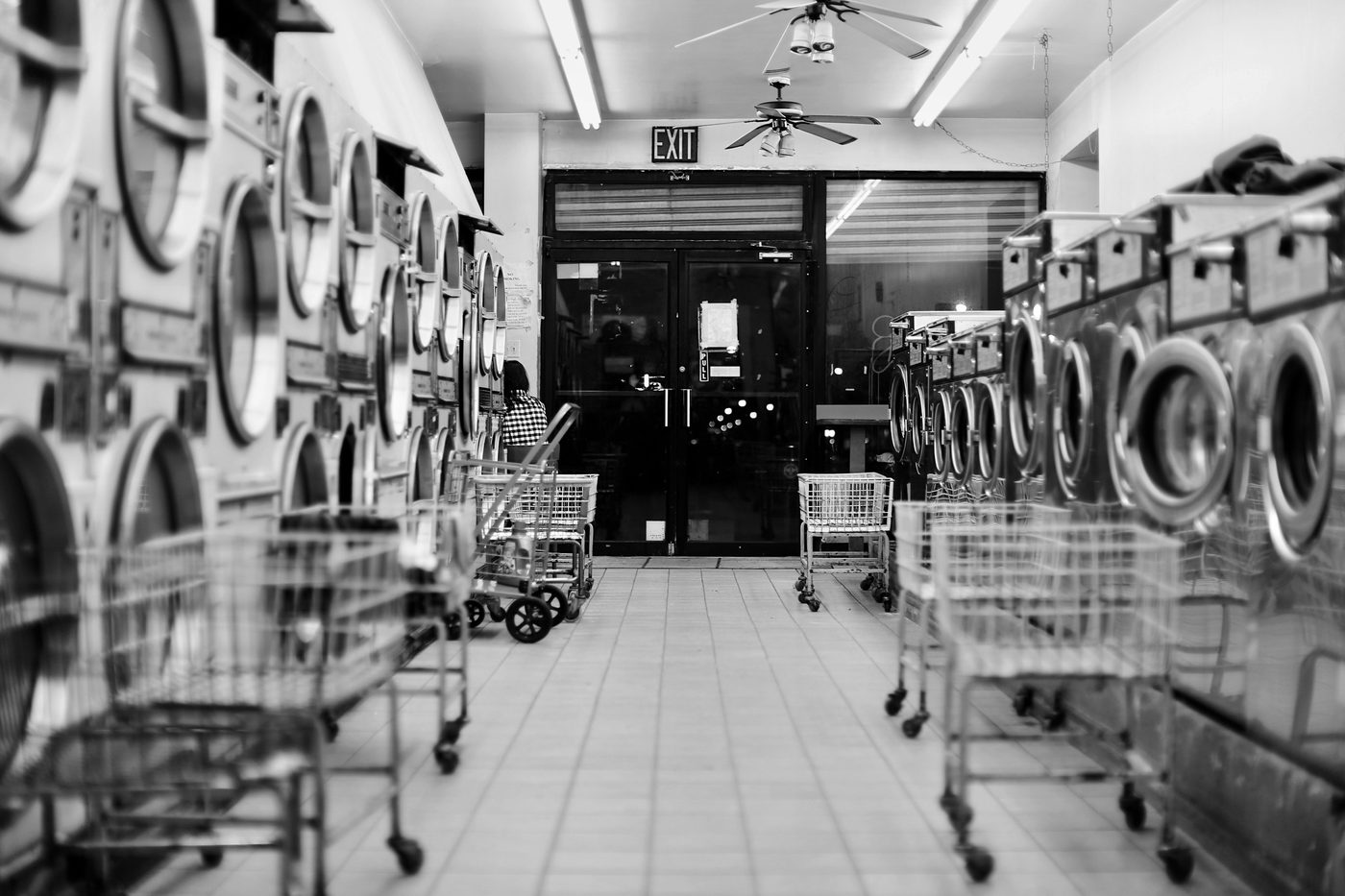 Row of laundry carts in a busy Los Angeles County laundromat